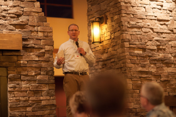 Mark talking at dinner